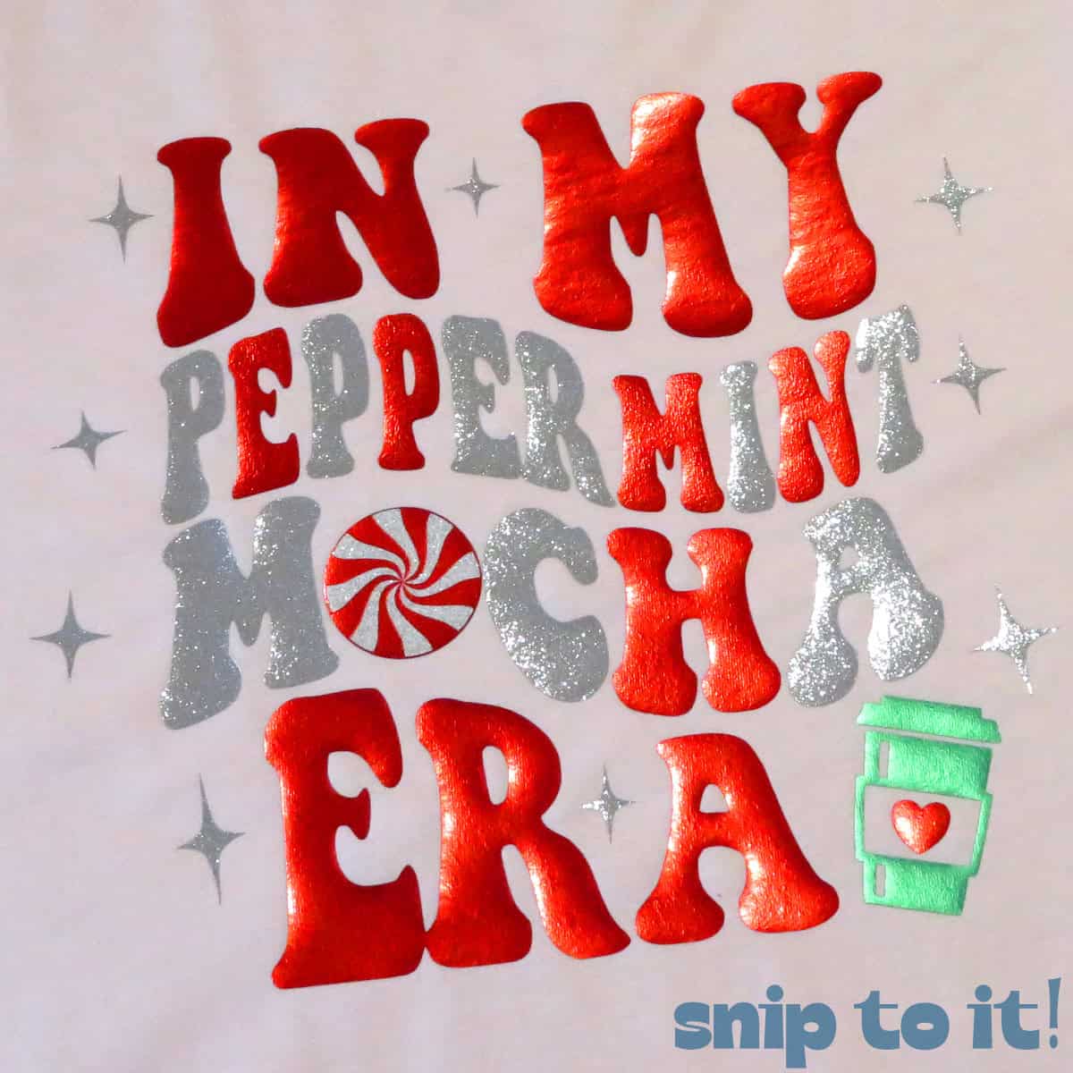 closeup of a colorful red and silver glitter htv t-shirt graphic reading In my Peppermint mocha era